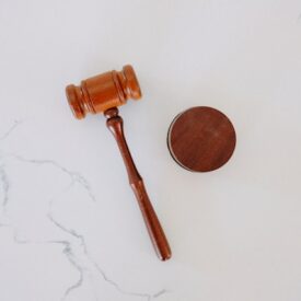 Image of a wooden gavel laid on a table.