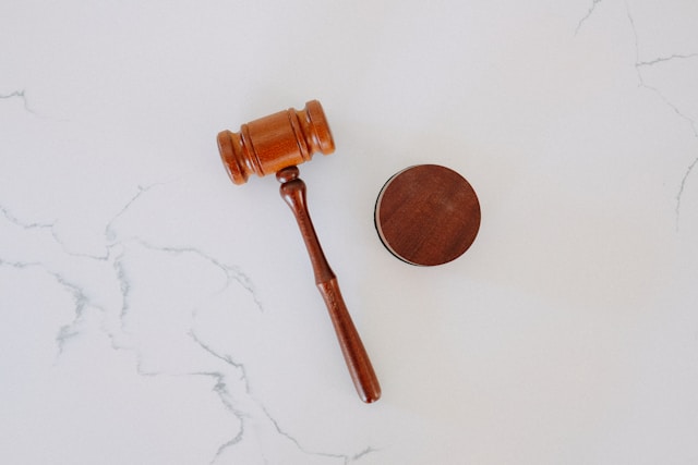 Image of a wooden gavel laid on a table.