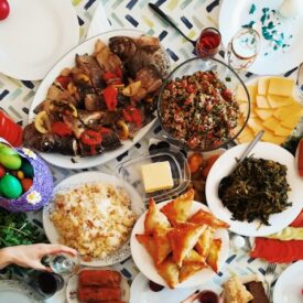 A feast of colorful food dishes spread on a table.