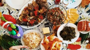 A feast of colorful food dishes spread on a table.