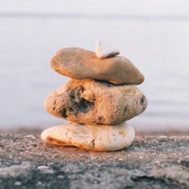 Four smooth rocks stacked upon one another